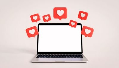 Laptop surrounded by social media heart notification icons